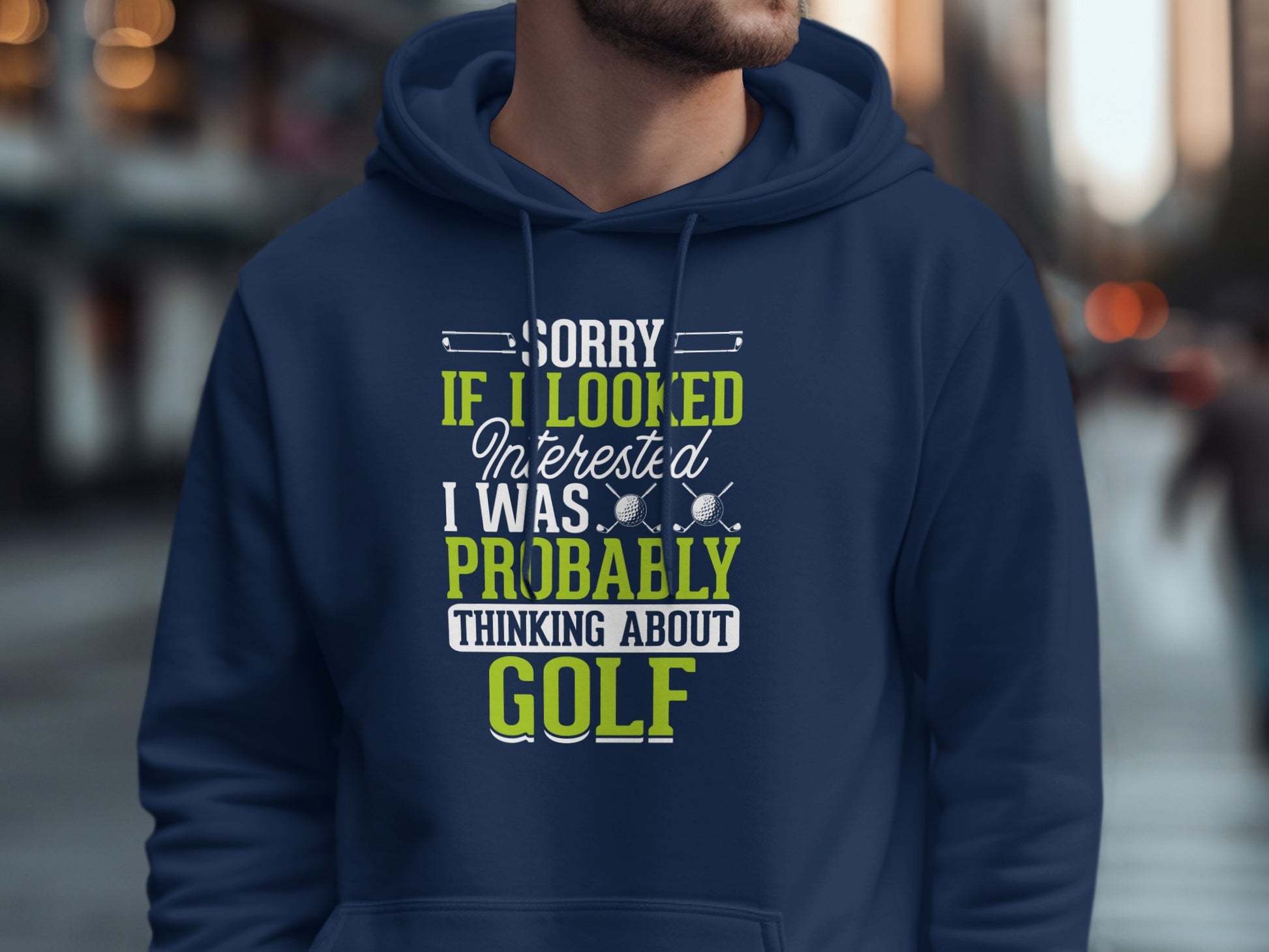 Navy blue hoodie with "SORRY IF I LOOKED INTERESTED I WAS PROBABLY THINKING ABOUT GOLF" text.