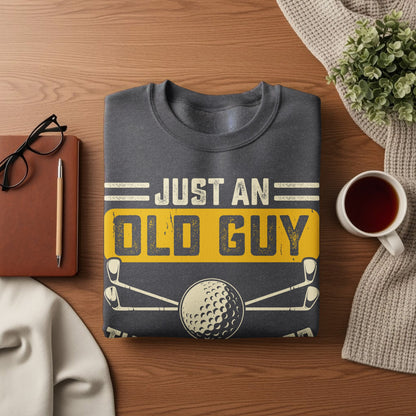 Gray sweatshirt with "Just An Old Guy" text and golf ball graphic.