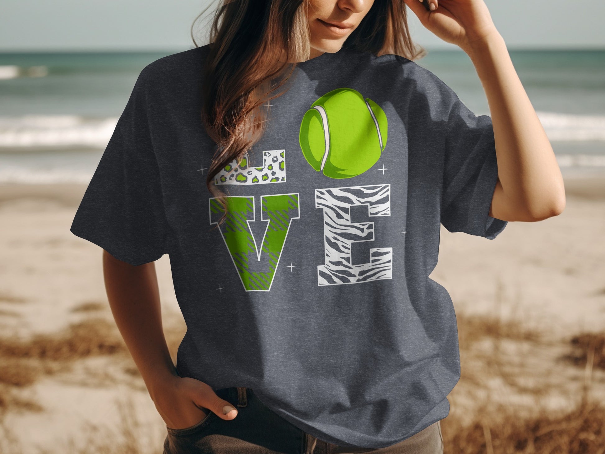 Dark grey t-shirt with "LOVE" design featuring a tennis ball and animal prints.