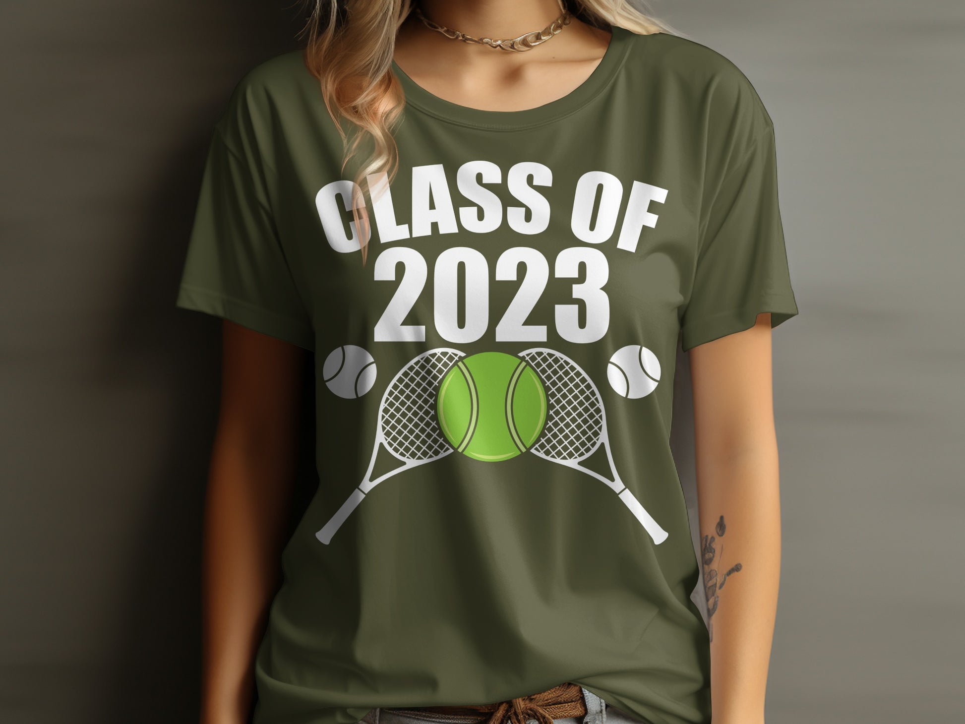 Green t-shirt with "Class of 2023" and tennis rackets and balls.