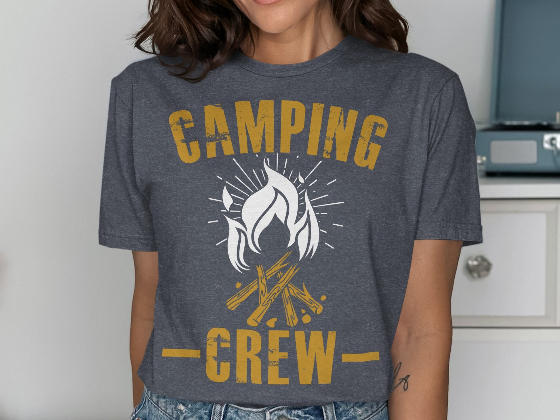 Dark gray t-shirt with "CAMPING CREW" text and campfire graphic.