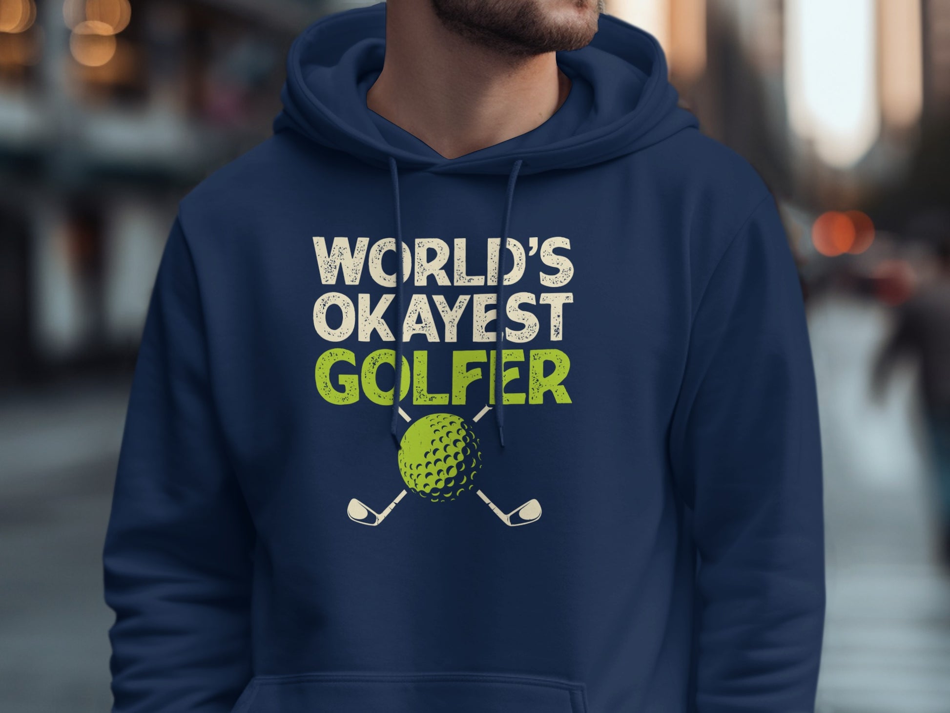Navy hoodie with "WORLD'S OKAYEST GOLFER" text and golf club graphics.