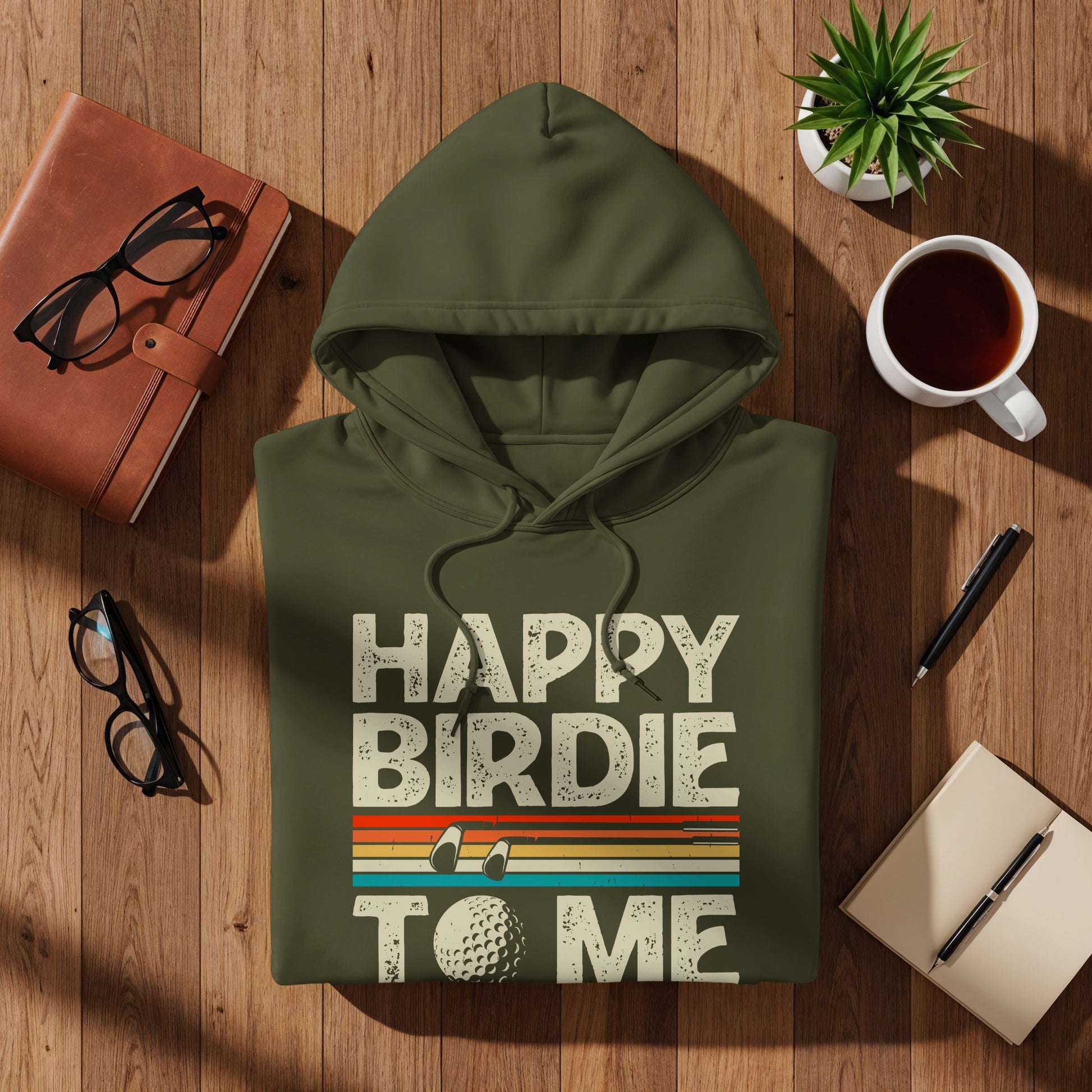 Green hoodie with "Happy Birdie To Me" and golf ball graphic.