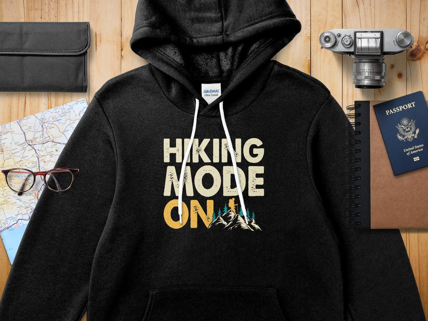 Black hoodie with "Hiking Mode On" text and mountain graphic.