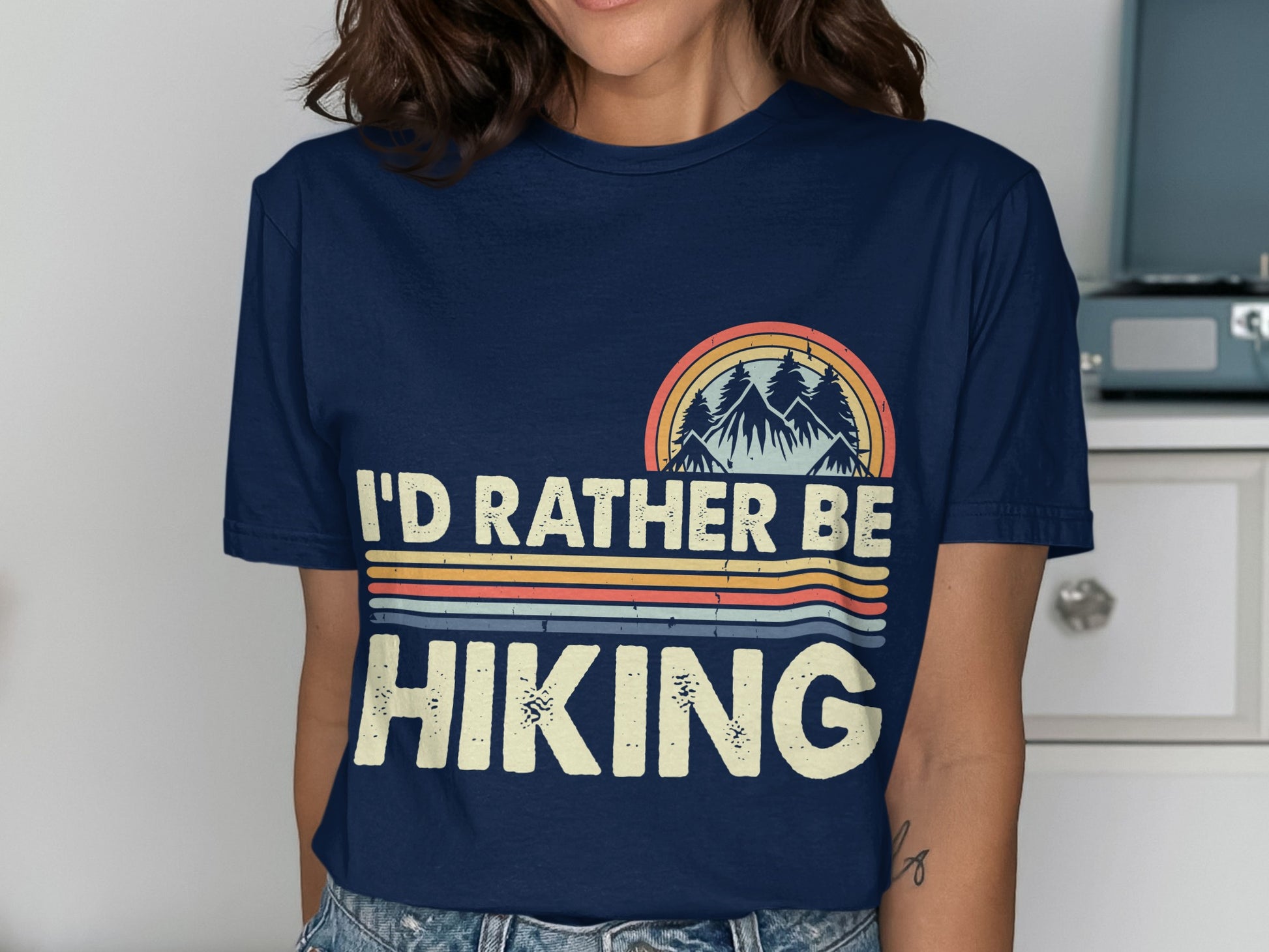 Navy t-shirt with "I'd Rather Be Hiking" graphic featuring mountains and rainbow stripes.
