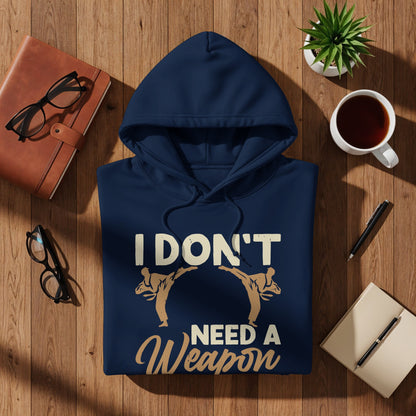 Navy blue hoodie with white text "I DON'T NEED A WEAPON" and martial arts figures.
