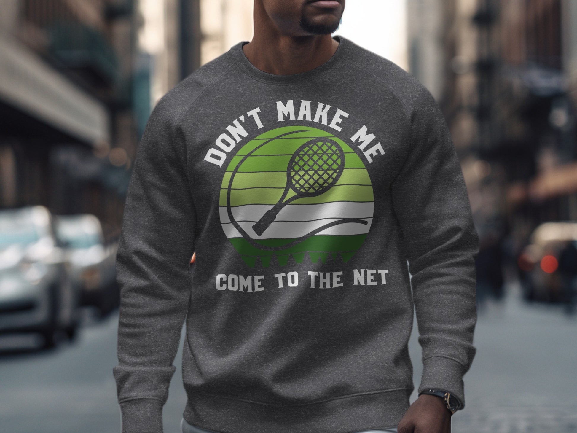 Grey sweatshirt with "Don't Make Me Come To The Net" and tennis racket graphic.