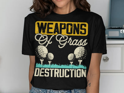 T-shirt with golf balls and "Weapons of Grass Destruction" text.