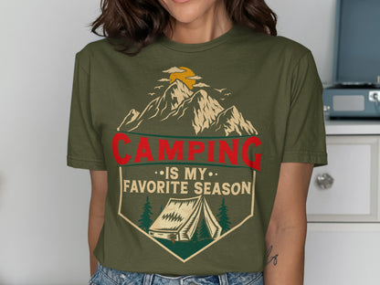 Green t-shirt with mountains, tent, sun, and text "Camping is my favorite season".