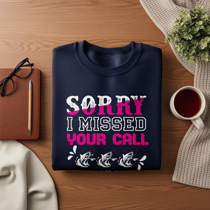 Navy sweatshirt with "Sorry I missed your call" text and fish graphic.