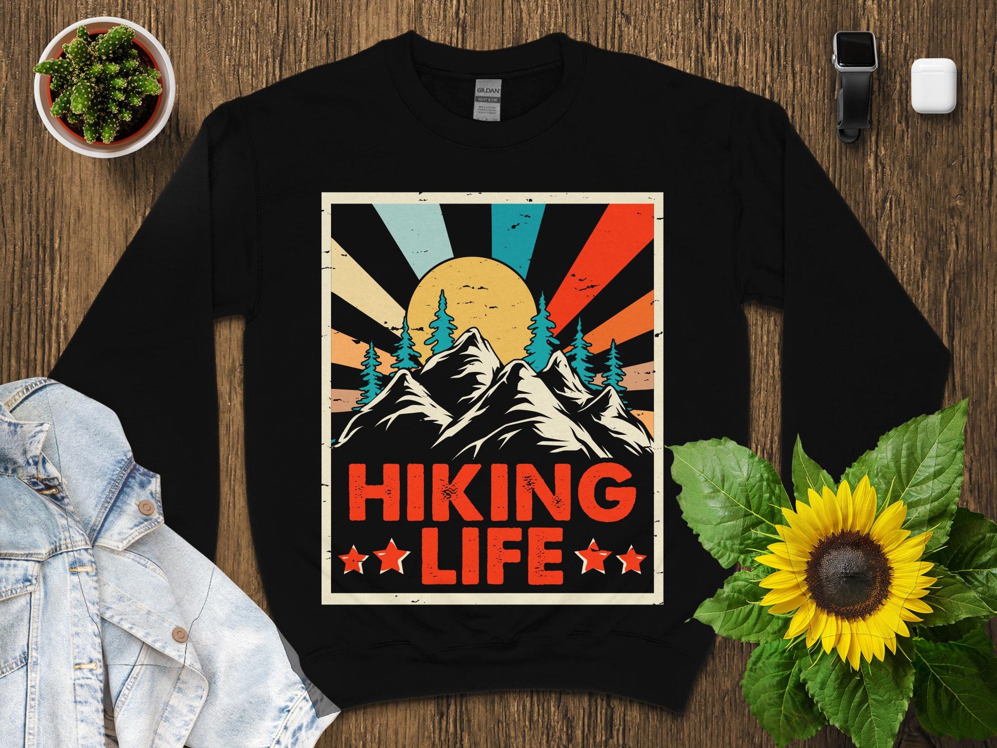 Black sweatshirt with vintage mountain sunset and "Hiking Life" text.