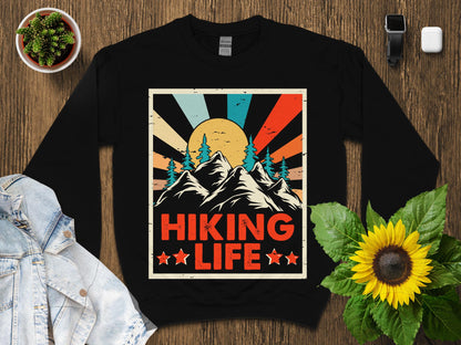 Black sweatshirt with vintage mountain sunset and "Hiking Life" text.
