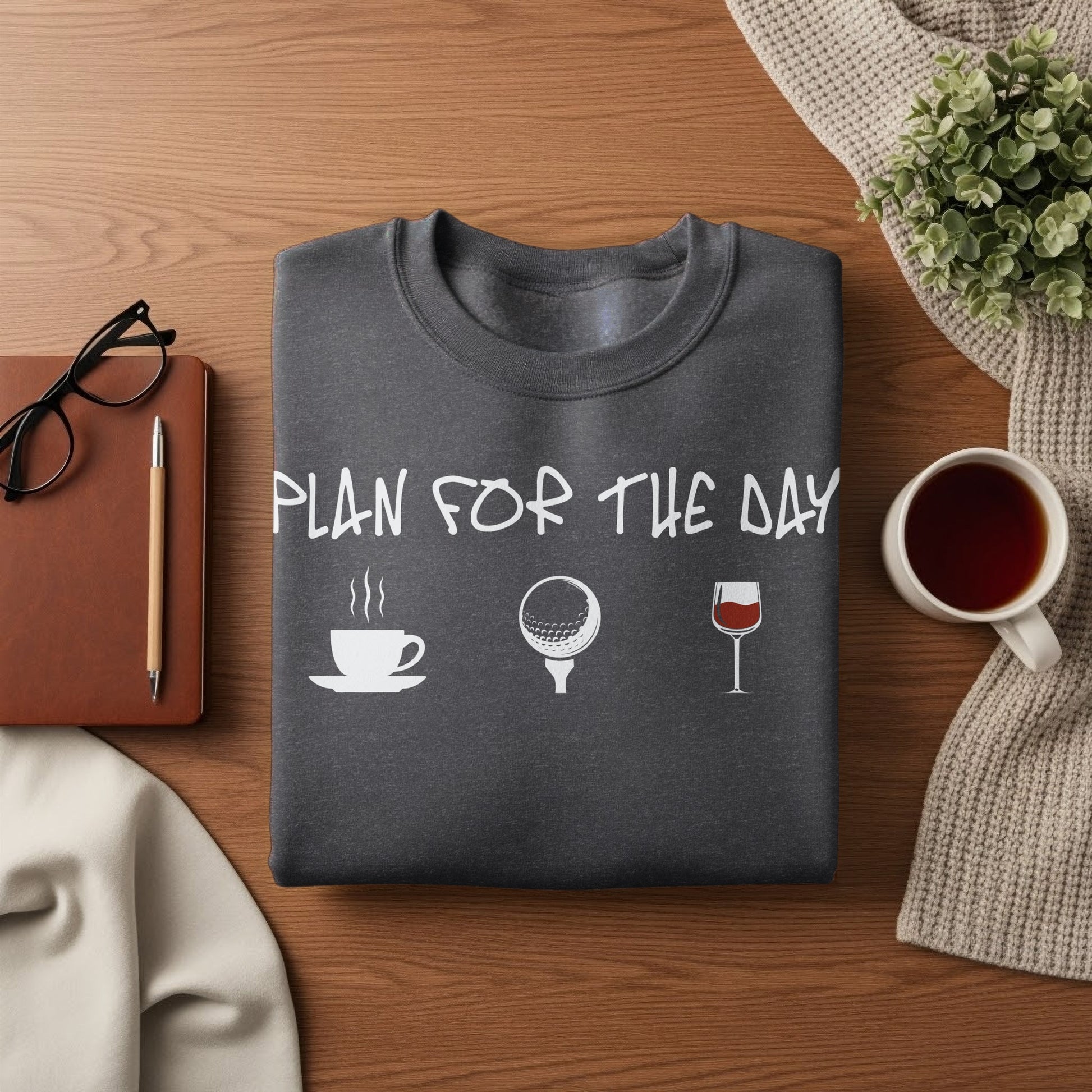 Dark gray sweatshirt with "PLAN FOR THE DAY" and icons for coffee, golf, and wine.