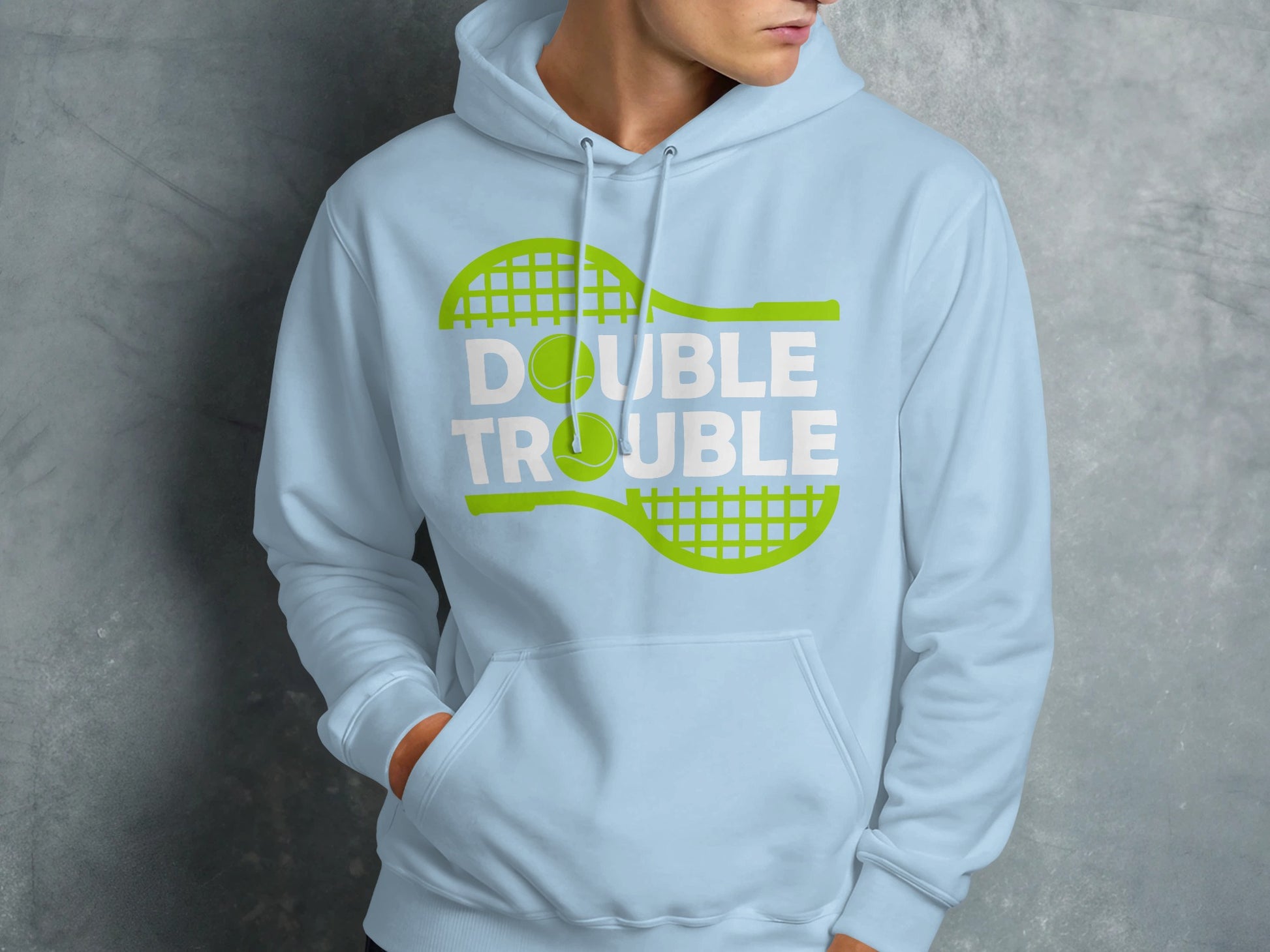 Light blue hoodie with "Double Trouble" text and tennis racket and ball graphic.