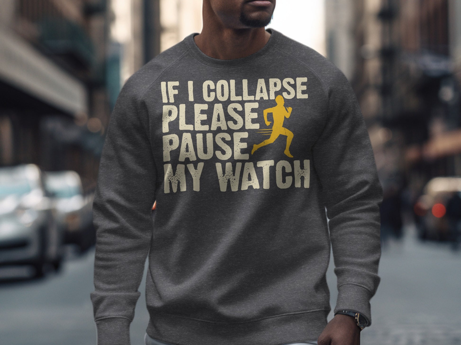 Gray sweatshirt with yellow text "IF I COLLAPSE PLEASE PAUSE MY WATCH" and runner graphic.