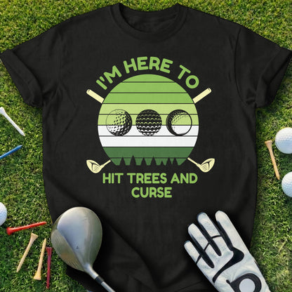 Black t-shirt with a graphic of three golf balls and "I'm here to hit trees and curse".