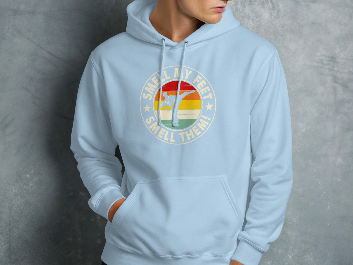 Light blue hoodie with "Smell my feet, smell them!" text and karate graphic.