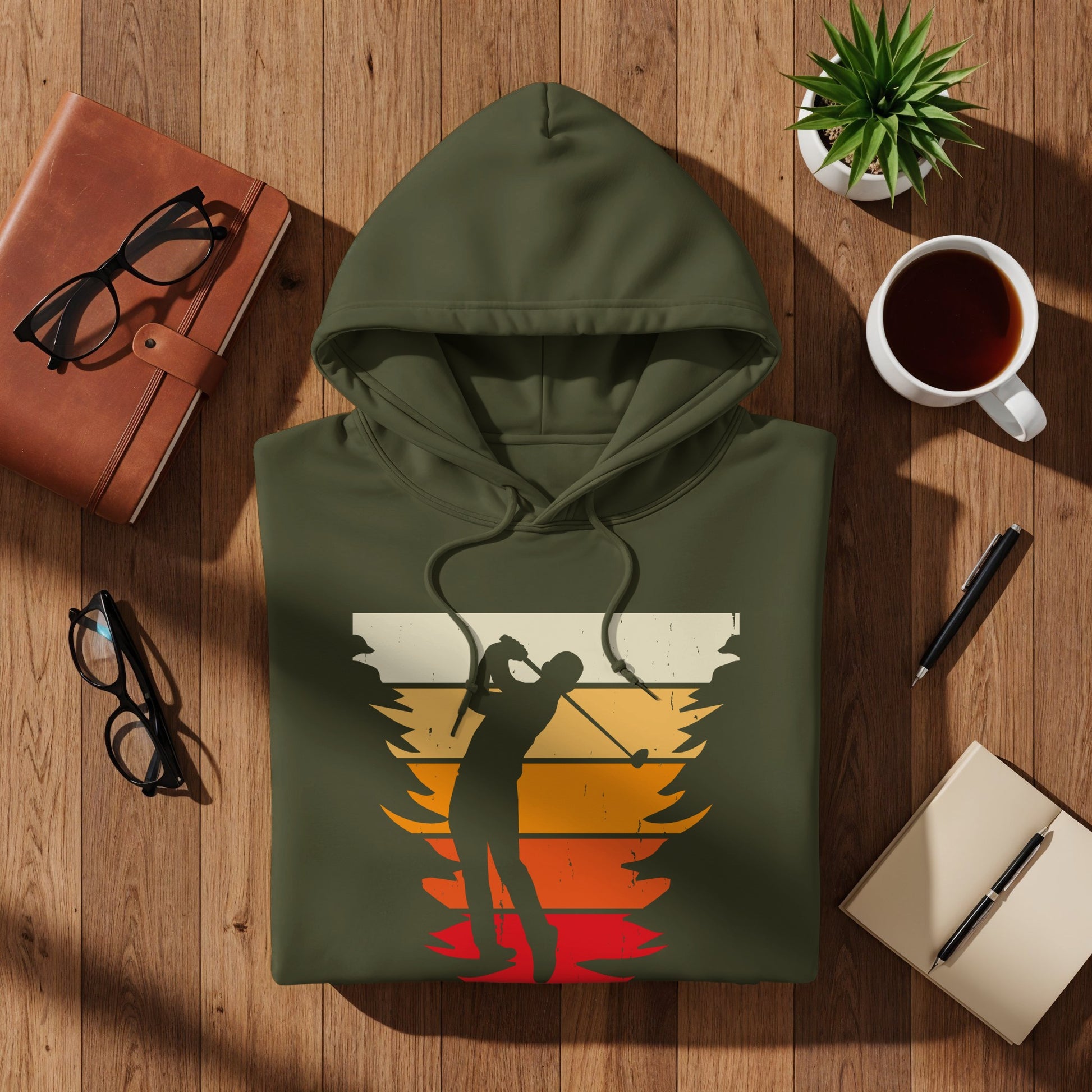 Olive green hoodie with vintage golfer silhouette graphic and sunset stripes.