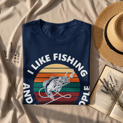 Dark blue t-shirt with "I Like Fishing And People" text and fishing graphic.