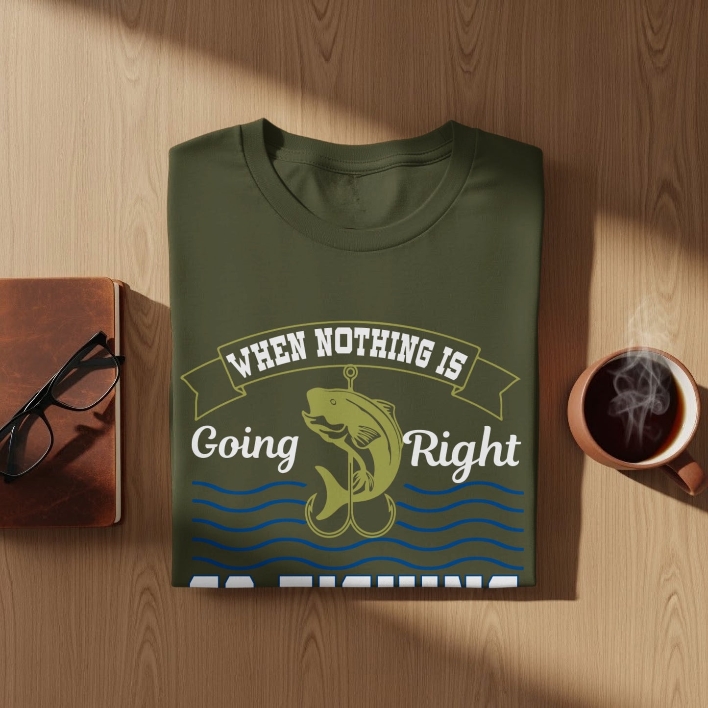 Olive green t-shirt with "When nothing is going right" text and a fishing hook.