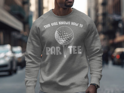 Gray sweatshirt with "This Girl Knows How to Par Tee" and a golf ball graphic.