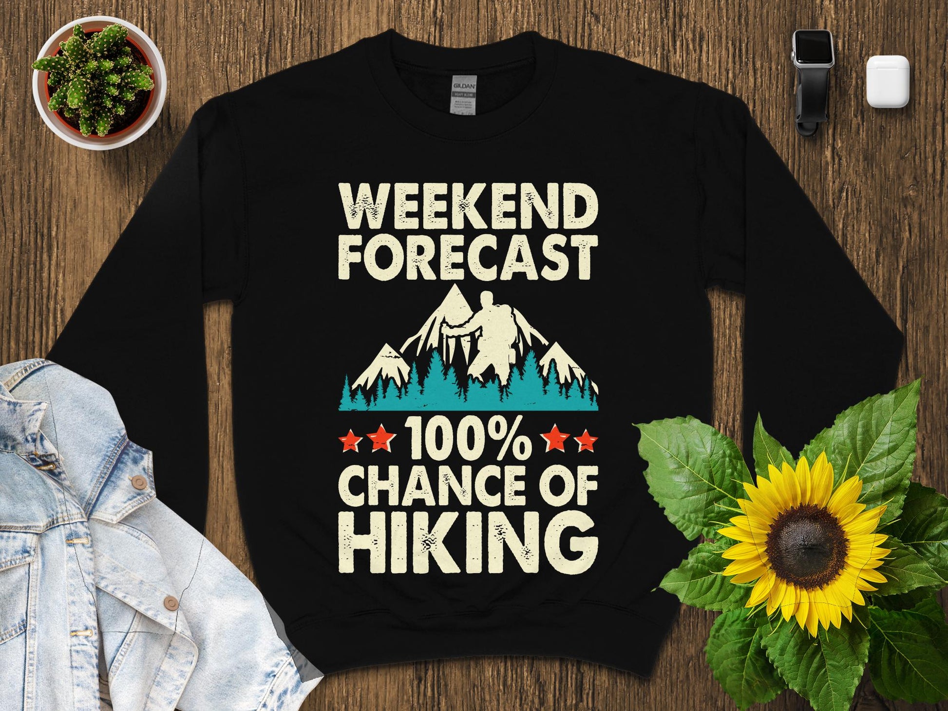 Black sweatshirt with "Weekend Forecast 100% Chance of Hiking" graphic.