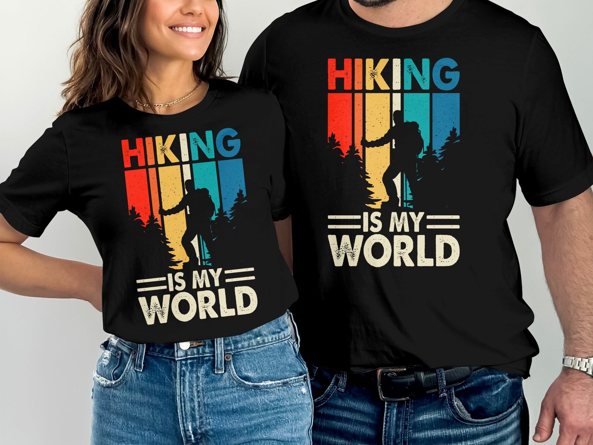 Two t-shirts with "Hiking is My World" and a vintage hiker silhouette design.