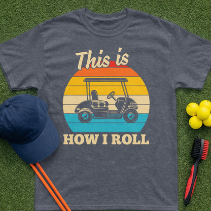 Dark grey t-shirt with "This is HOW I ROLL" and a golf cart graphic.