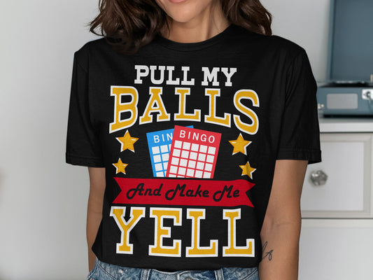 Black t-shirt with "Pull My Balls And Make Me Yell" and bingo cards.