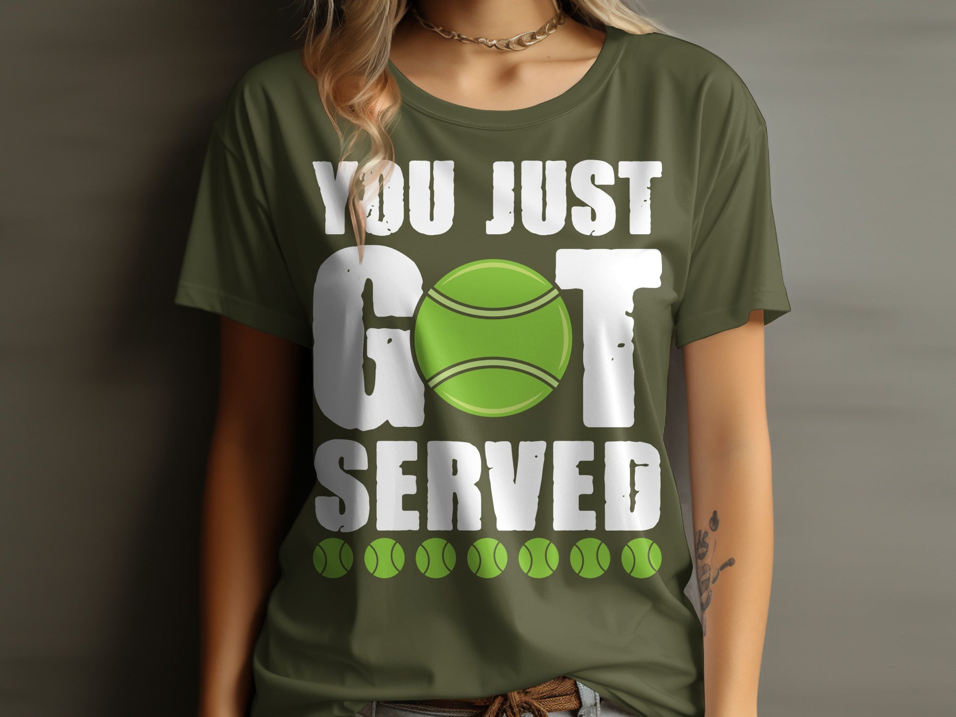 Green t-shirt with "YOU JUST GOT SERVED" and tennis ball graphics.