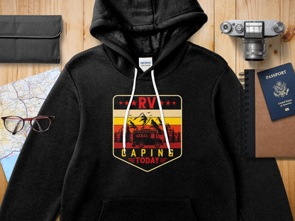 Black hoodie with RV camping graphic featuring mountains, trees, and a sun.