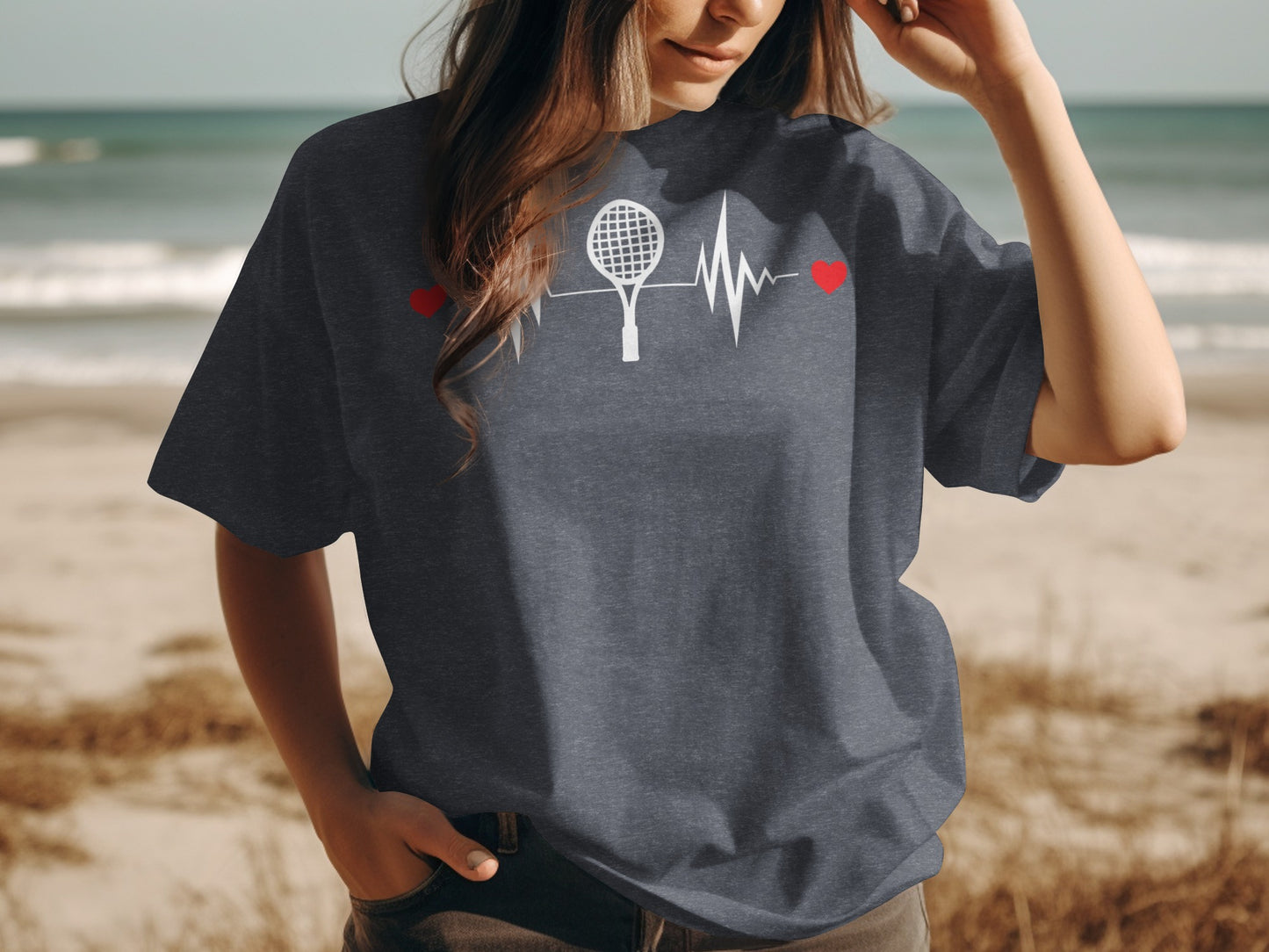Dark t-shirt with tennis racket and heartbeat graphic.
