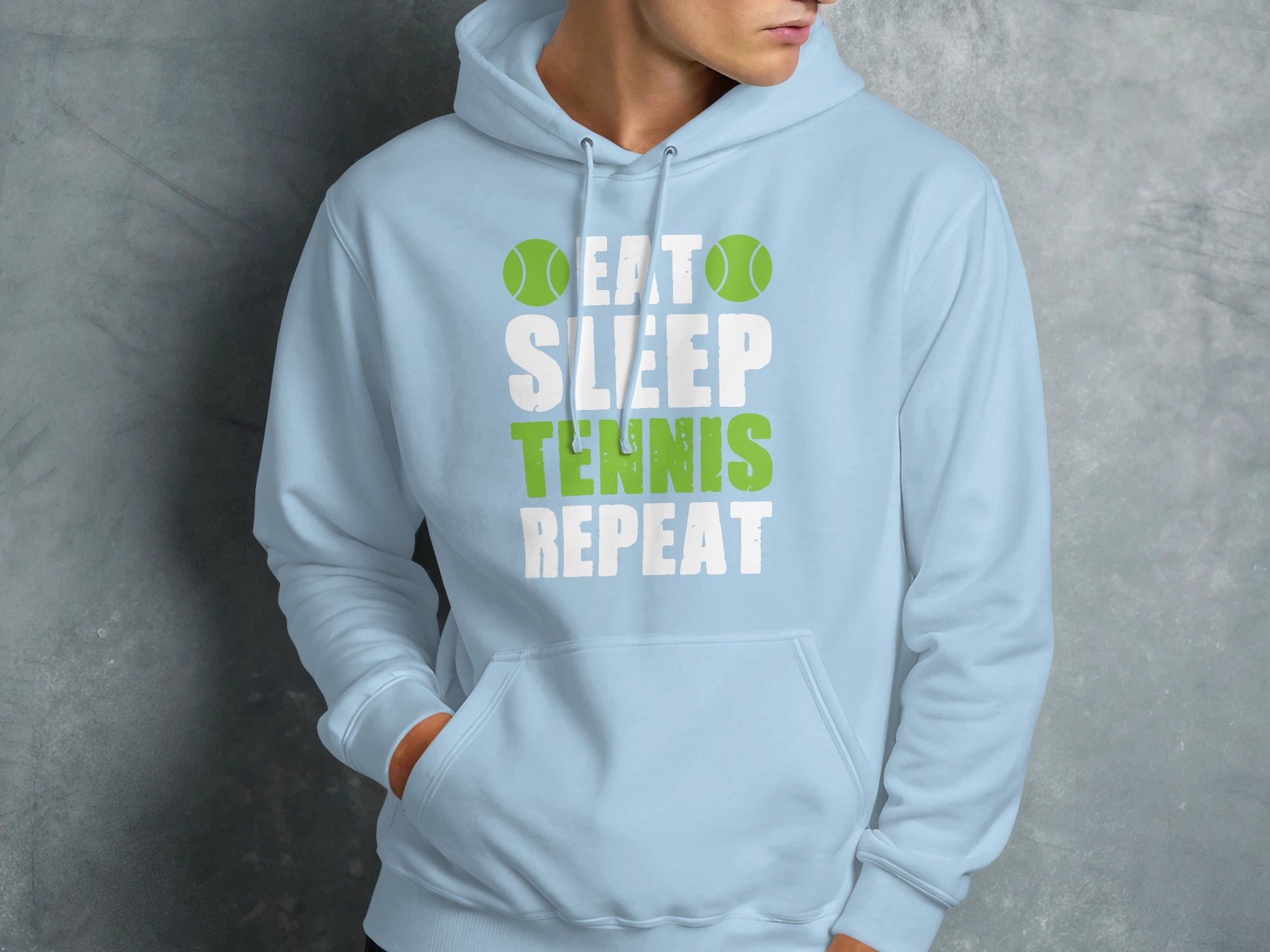 Light blue hoodie with "Eat Sleep Tennis Repeat" text and tennis ball graphics.