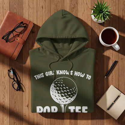 Olive green hoodie with "This girl knows how to golf" text and golf ball graphic.