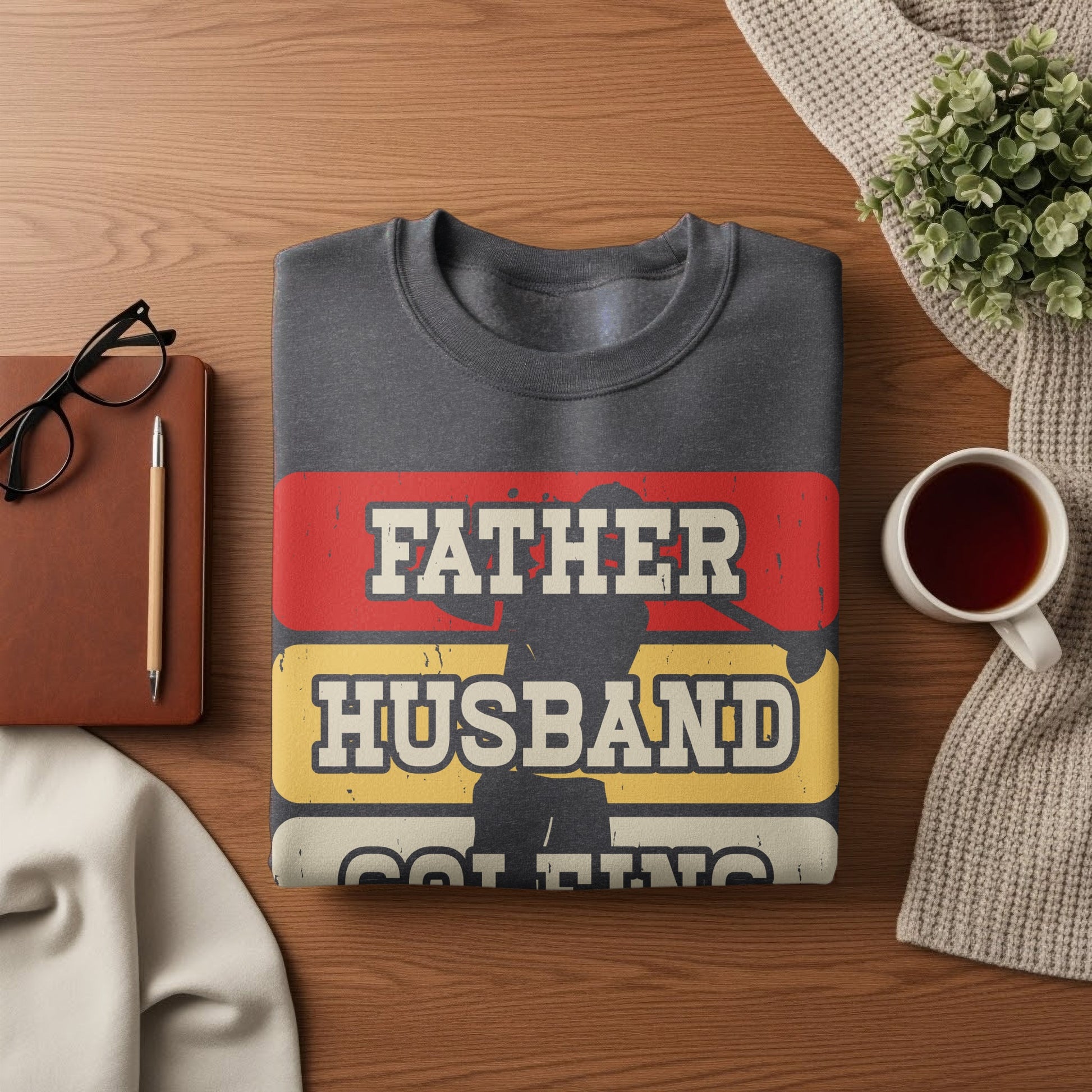 Dark grey sweatshirt with "Father Husband" text and silhouette.