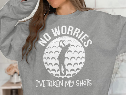 Grey sweatshirt with white graphic of golfer and text "No Worries, I've Taken My Shots".