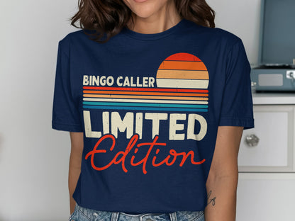 Navy t-shirt with "Bingo Caller LIMITED Edition" text and a sunset graphic.