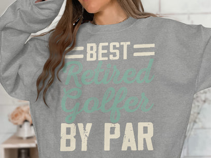 Grey sweatshirt with "BEST RETIRED GOLFER BY PAR" text.