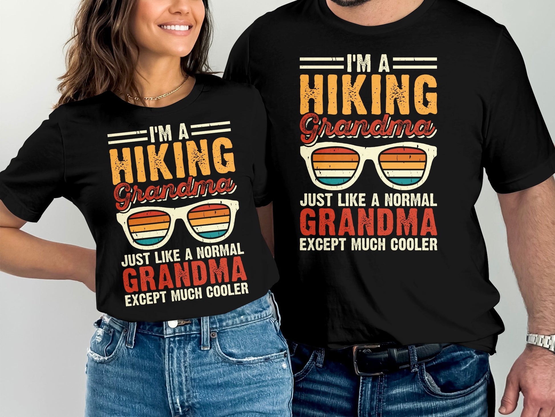 Two black t-shirts with "Hiking Grandma" graphic and sunglasses.