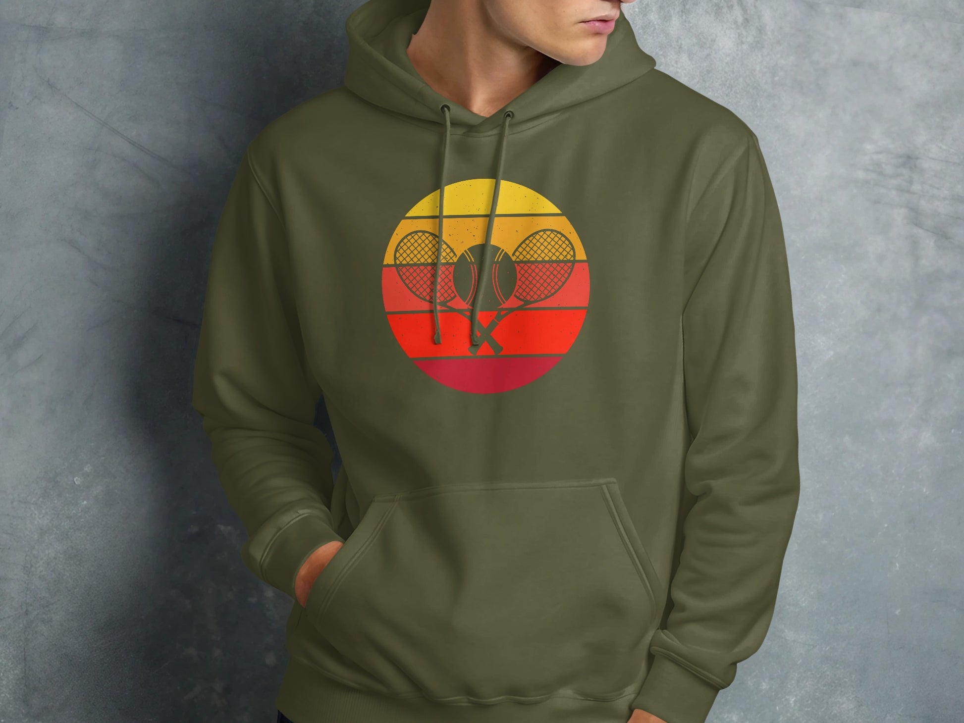 Green hoodie featuring a retro tennis graphic with rackets and a sun.
