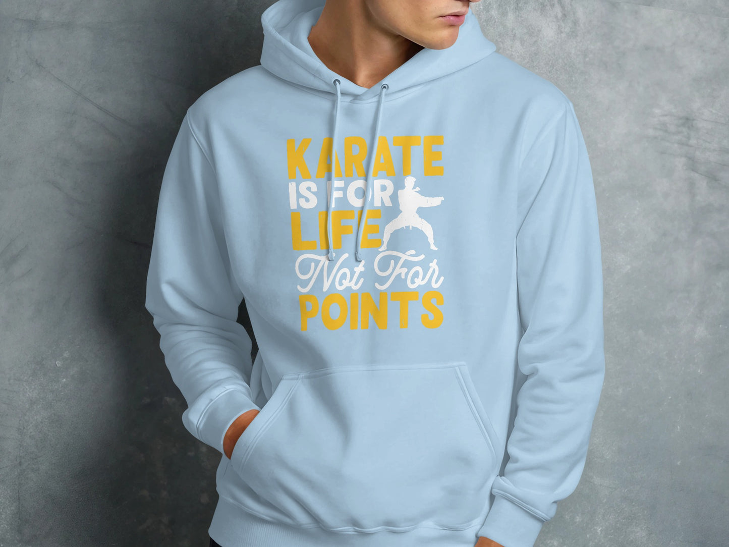 Light blue hoodie with "KARATE IS FOR LIFE NOT FOR POINTS" text and karate silhouette.