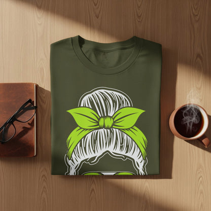 Olive green t-shirt with a green bow hairstyle graphic.