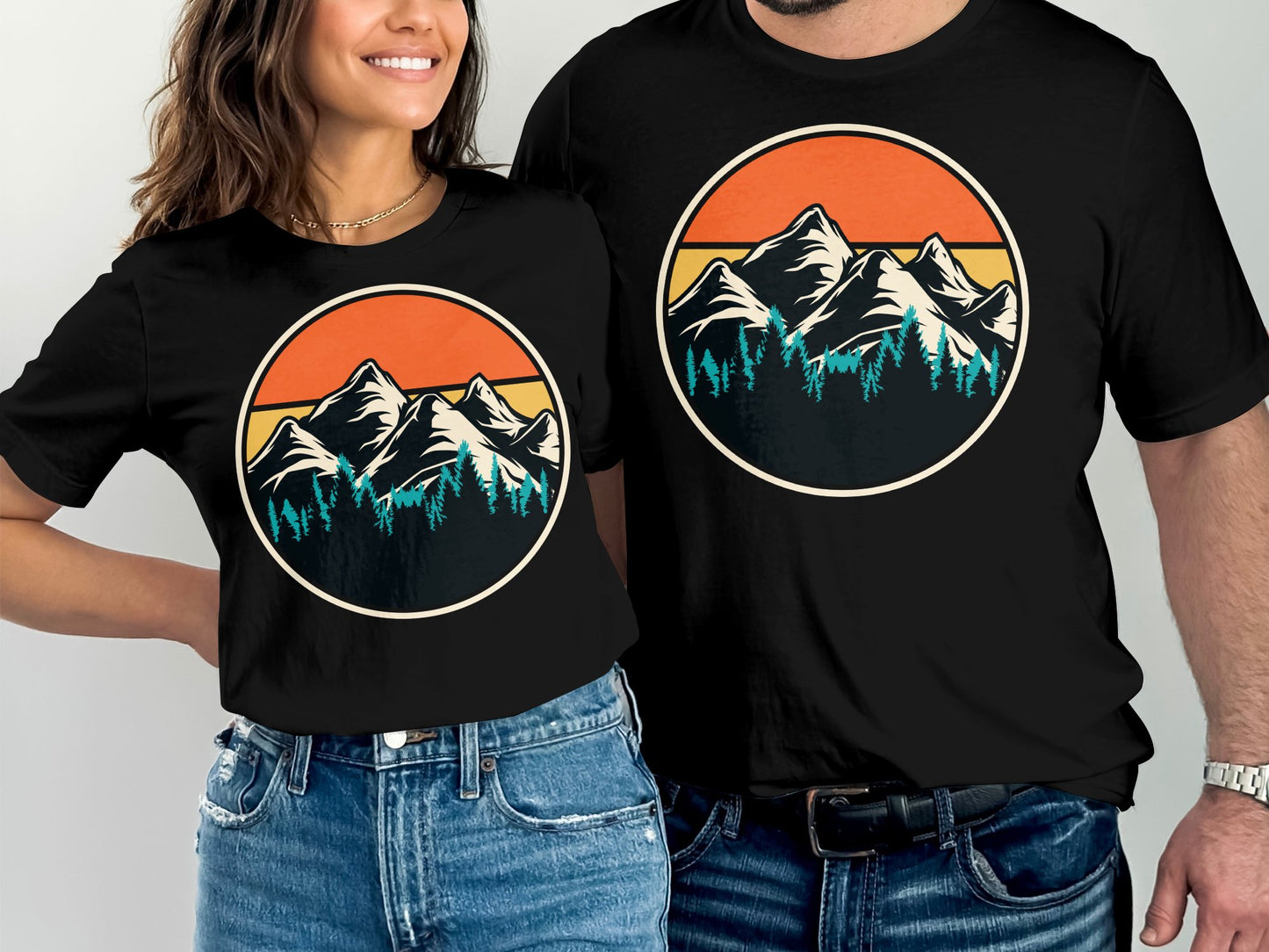 T-shirts featuring a vintage mountain and forest sunset graphic.