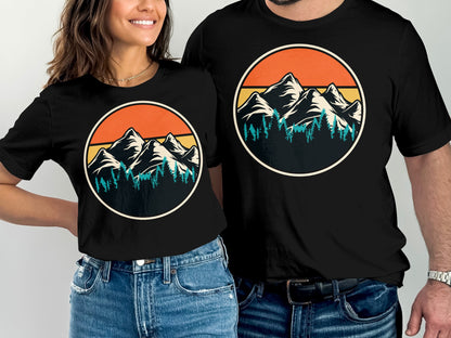T-shirts featuring a vintage mountain and forest sunset graphic.