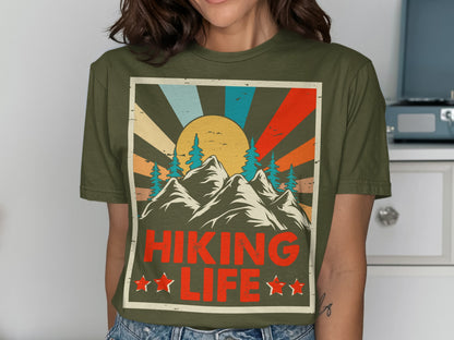 Green t-shirt with mountain, sun, and "Hiking Life" text graphic.