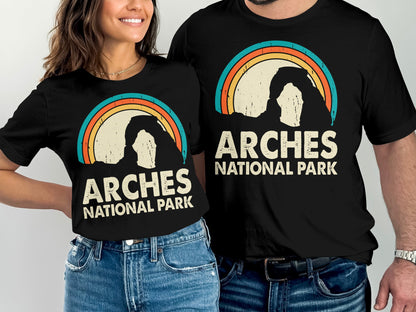 Arches National Park graphic on black t-shirts worn by a man and woman.