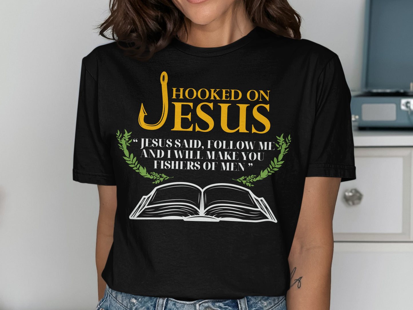 Black t-shirt with "Hooked on Jesus" text and Bible quote.
