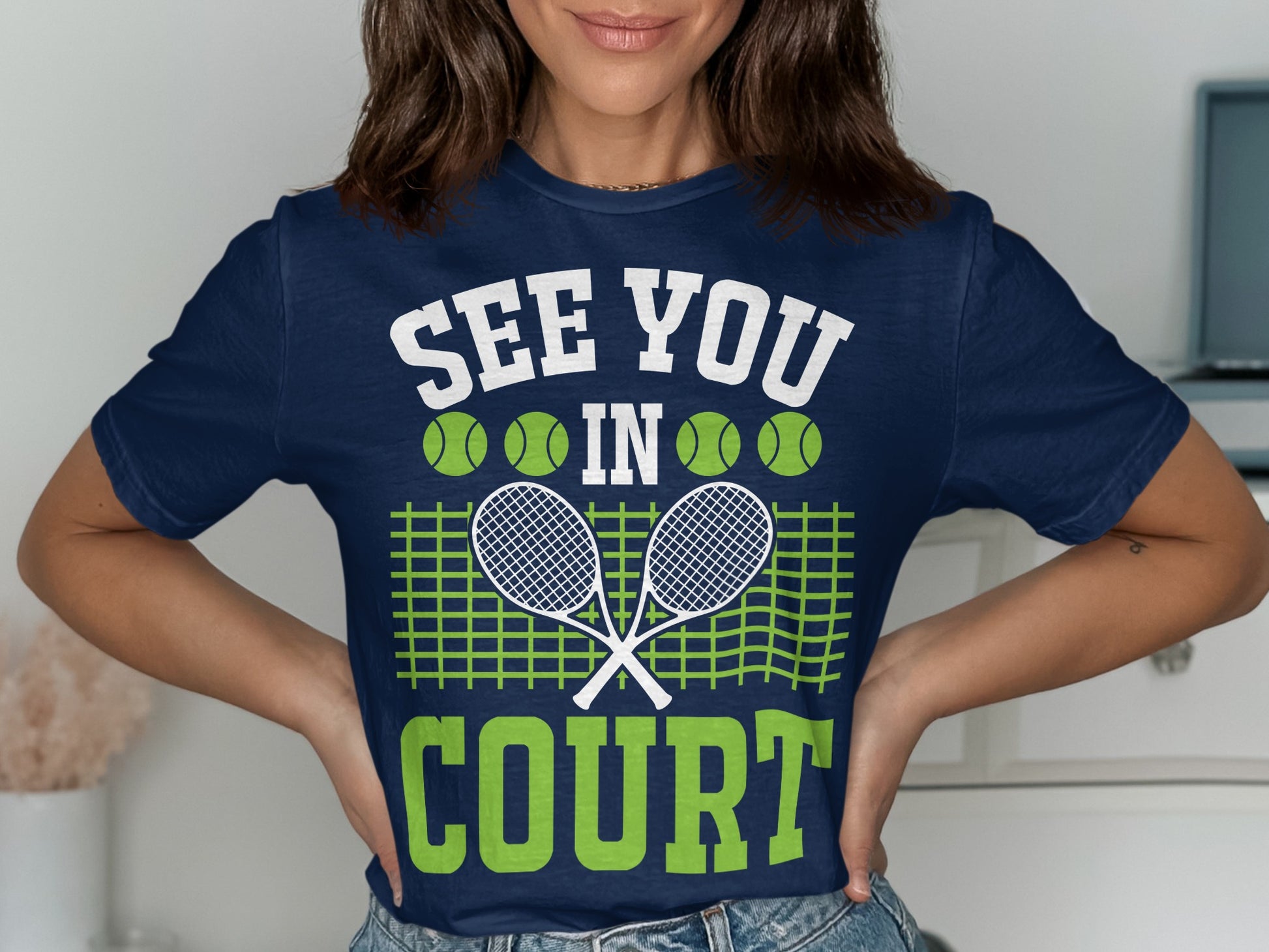 Navy t-shirt with "See You In Court" text, tennis rackets, and balls.