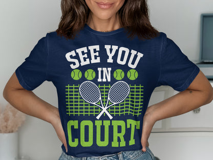 Navy t-shirt with "See You In Court" text, tennis rackets, and balls.