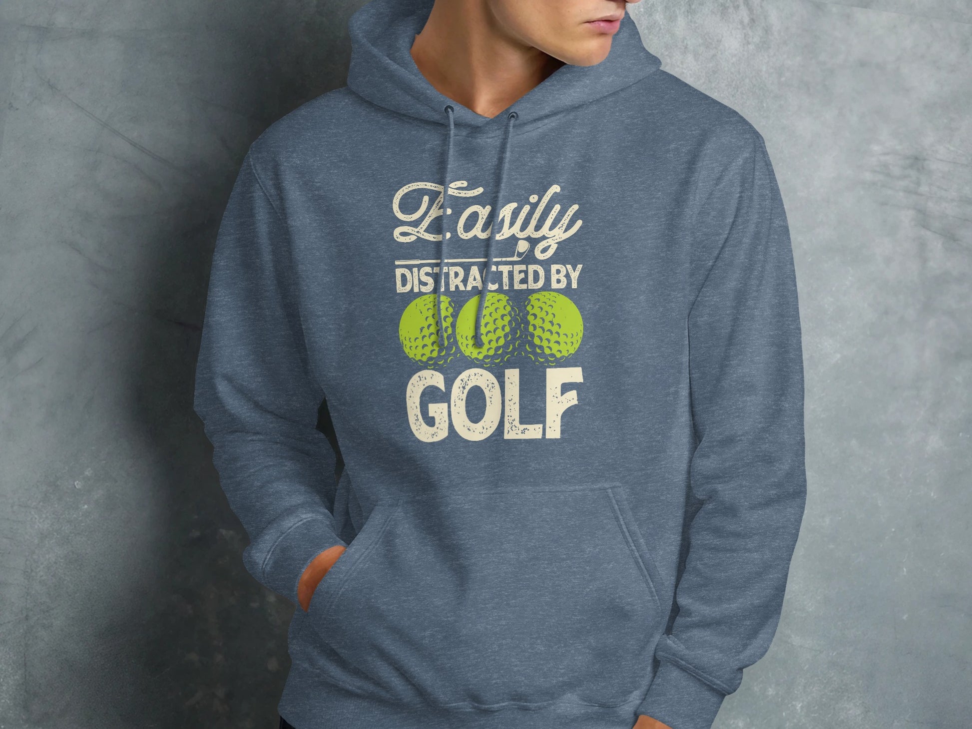 Hoodie with "Easily distracted by GOLF" text and golf balls.
